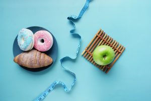 comparing healthy and junk food concept on table